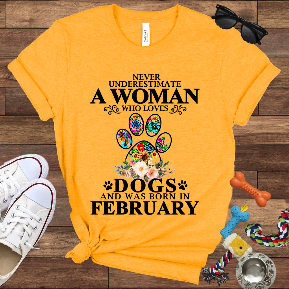 Never Underestimate A Woman Who Loves Dogs And Was Born In February - Bella Canvas T-shirt: Great Gifts for Dog Owners