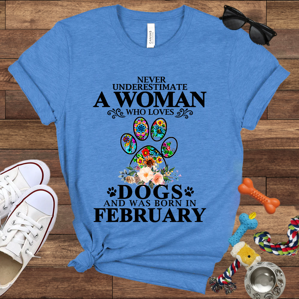 Never Underestimate A Woman Who Loves Dogs And Was Born In February - Bella Canvas T-shirt: Great Gifts for Dog Owners